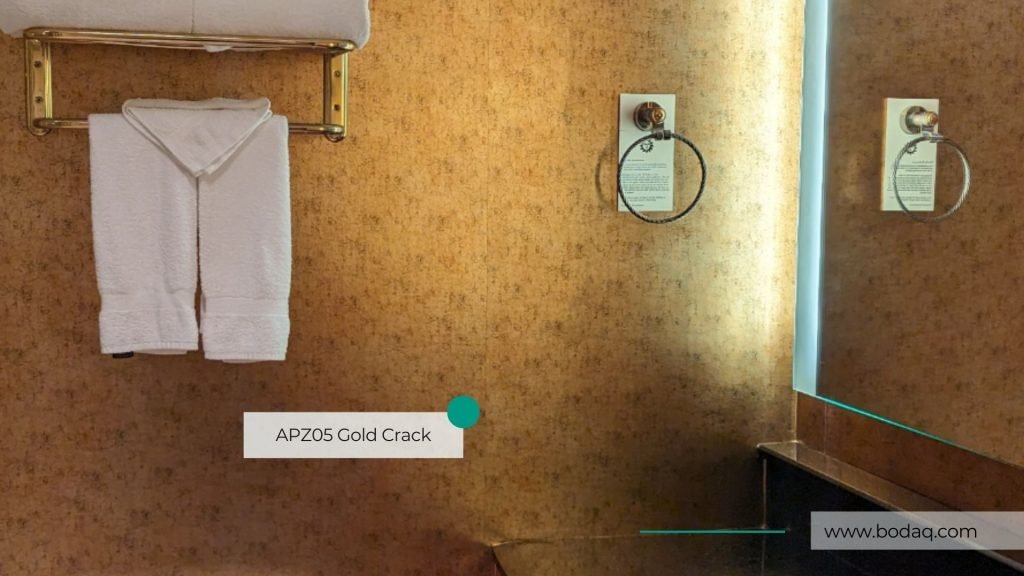 APZ05 Gold Crack Bodaq Interior Film - Natural Surface Collection 9 APZ05 Gold Crack Bodaq Interior Film applied to the wall in the hotel's bathroom.
