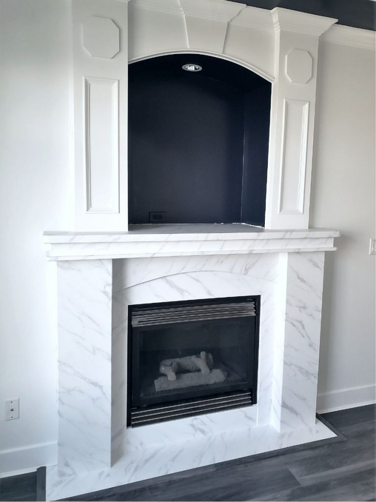 Fireplace refinishing with vinyl film