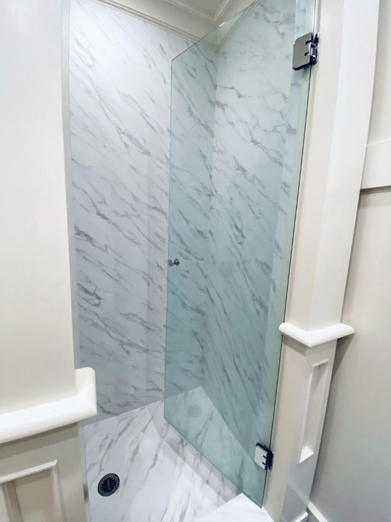 Shower stall refinishing with vinyl film