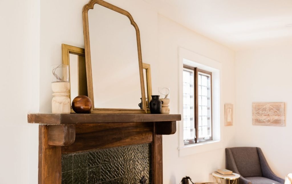 Add a mirror or a few mirrors to your mantel for some sparkles