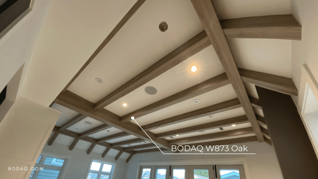 Ceiling beams wrapped with architectural vinyl